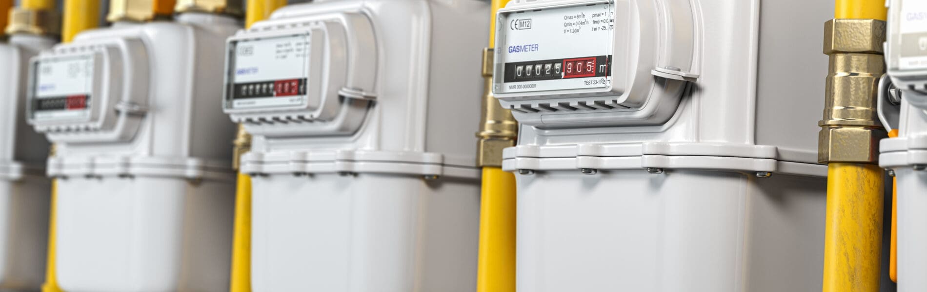 Row of gas meters installed in a household representing consumer energy contracts and usage measurement.
